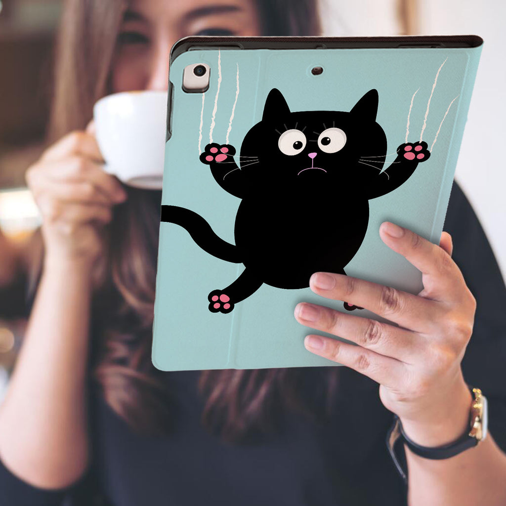 a girl is holding and viewing personalized iPad folio case with Cat Kitty design