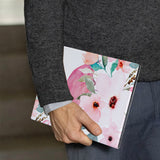 A business man holds Personalized VistaCase reMarkable Pen Holder Case with Flamingo design